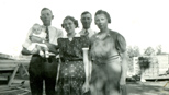 The Estel's: Bob holding Dick, Hazel, Frank, Mabel at the lumber yard, late 1939