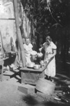 Ruby Merrill and Mabel Estel, cooking at Owl Creek Mill, August 1935